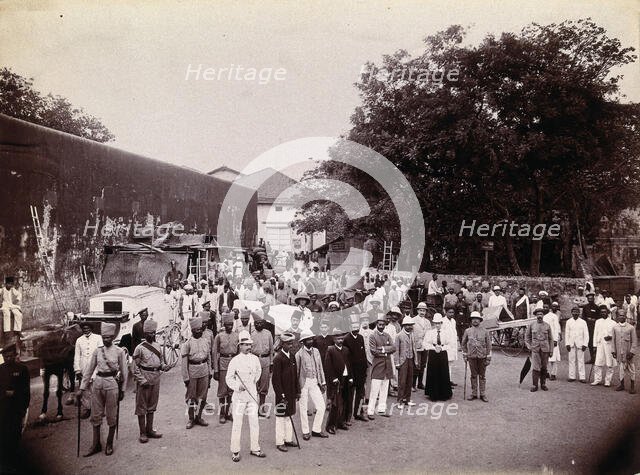 A group comprising doctors, health and public officials gathered on a street in Bombay..., 1896/1897 Creator: Unknown.