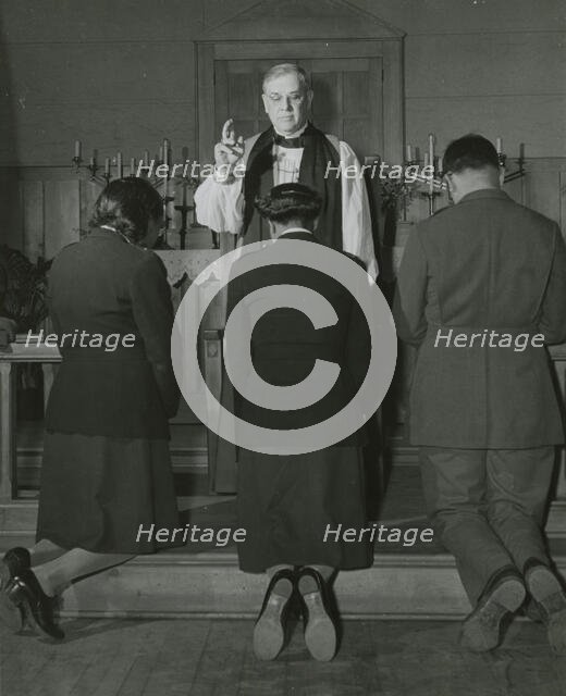 An Episcopal Bishop confirming African American Lieutenants Rosemary Vincent..., 1939 - 1945. Creator: United States Army.