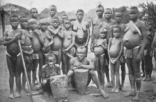 Bambute Pygmy group with two Walese women, 1902. Artist: Unknown.