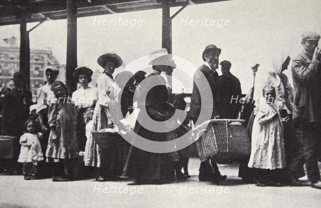 Immigrants arriving at Ellis Island, New York City, USA, c1905. Artist: Unknown
