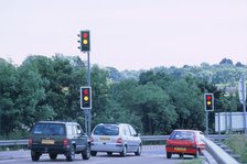 Traffic stopped at Traffic lights. Artist: Unknown.