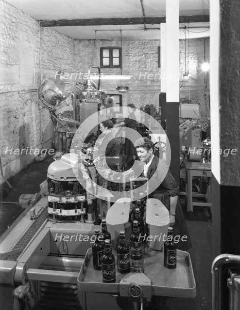 The final stages of bottling whisky at Wiley & Co, Sheffield, South Yorkshire, 1960.  Artist: Michael Walters