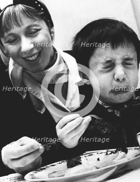 Child tasting bitter herbs at Passover, 1992. Artist: John Nathan