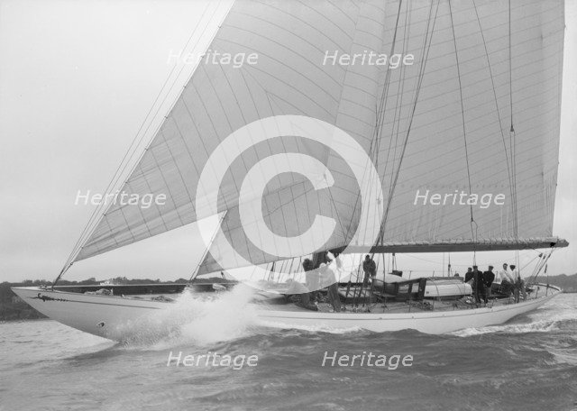The cutter 'Minstrel' competing in the round Island Race, 1938. Creator: Kirk & Sons of Cowes.