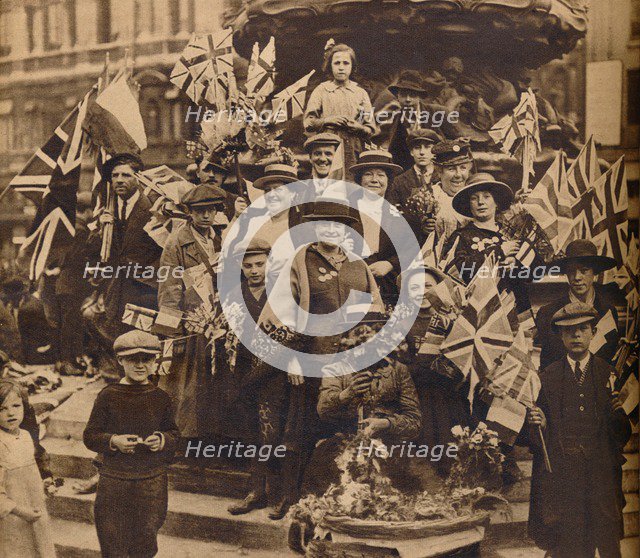 Victory celebrations underneath Eros, Piccadilly, London, 1918, (1938). Artist: Unknown.