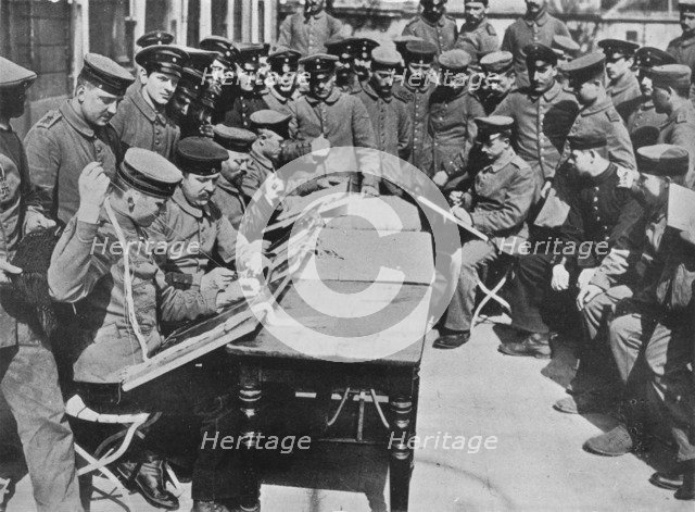 'The treatment of German wounded', 1915. Artist: Unknown.