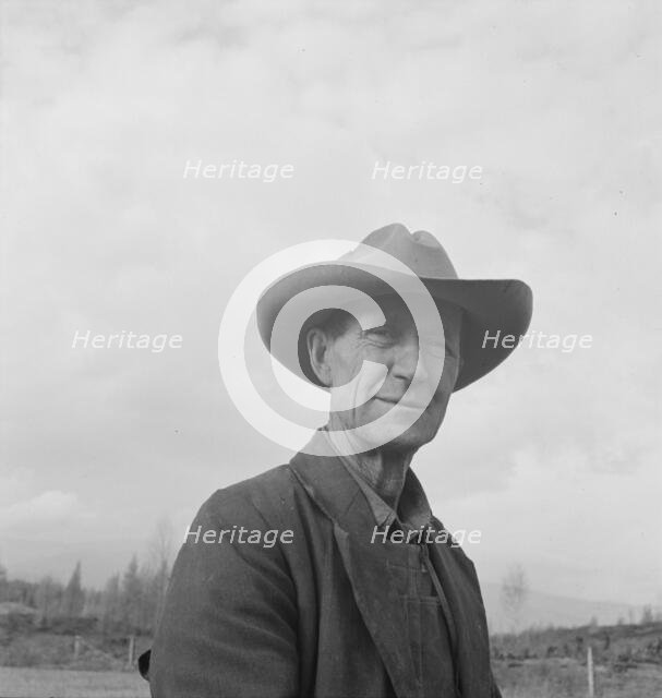 Farmer from Nebraska now developing eighty-acre stump farm, Bonner County, Idaho, 1939. Creator: Dorothea Lange.