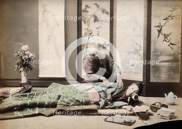 A Japanese woman being massaged by a blind Japanese masseur, c1890s. Creator: Unknown.