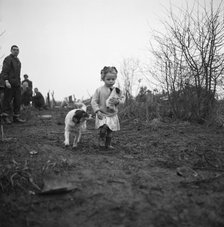 Gipsy child with a puppy, Lewes, Sussex, 1963.