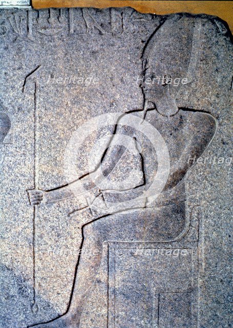 Detail of a stone engraving depicting a priest.