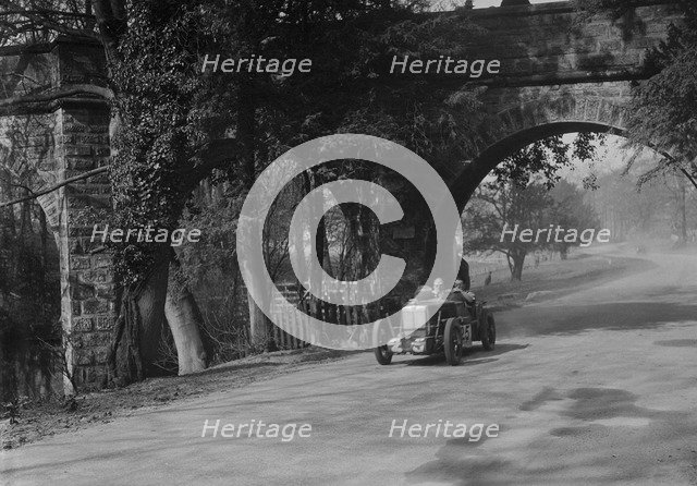 MG Midget of Eddie Hall at Starkey's Bridge, Donington Park, Leicestershire, 1933. Artist: Bill Brunell.