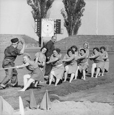 Women's tug of war team in action, Landskrona Stadium, Sweden, 1957. Artist: Unknown