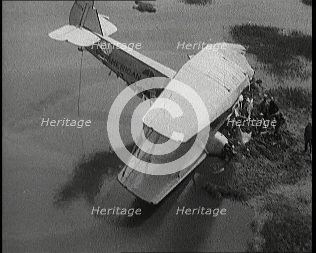 Bystanders Looking at the Wreckage of 'The American Legion' After It Had Crashed, 1927. Creator: British Pathe Ltd.