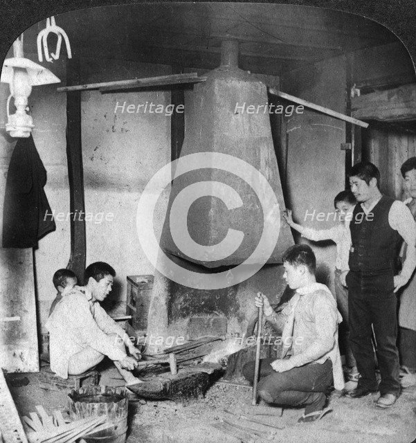 A Japanese blacksmith at his forge, Yokohama, Japan, 1904.Artist: Underwood & Underwood