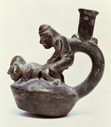 Anthropomorphic Vase with stirrup handle depicting two male persons performing a sex act, belongi…