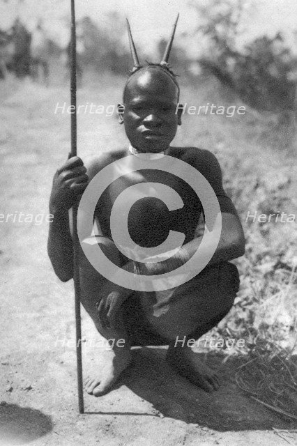 A boy with 'horns', Abercorn to Tukuyu, Tanganyika, 1925 (1927). Artist: Thomas A Glover