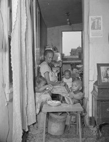 Mrs. Ella Watson, a government charwoman and her grandchildren, Washington, D.C., 1942. Creator: Gordon Parks.