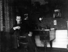 Rainer Maria Rilke in his study, c. 1905. Creator: Anonymous.
