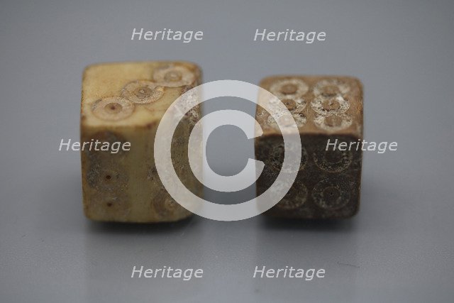 A pair of Roman dice made from carved bone, 1st century BC.
