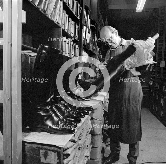 The interior of the workshop where Mr Eric Lobb is at work on a boot, London, c1946-c1959. Artist: John Gay