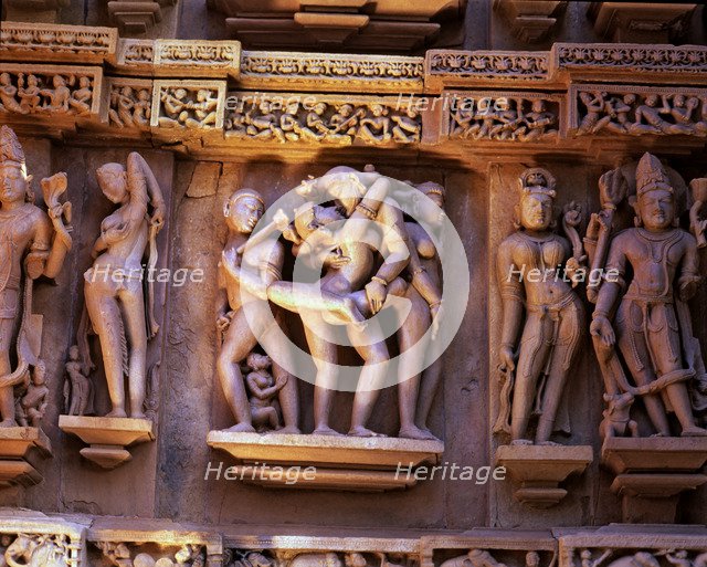 Reliefs with erotic scenes in the Lakshmana Temple, Kajuraho, India..