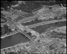 Hampton Court and construction of the new Hampton Court Bridge alongside the old one, c1930s. Creator: Arthur William Hobart.