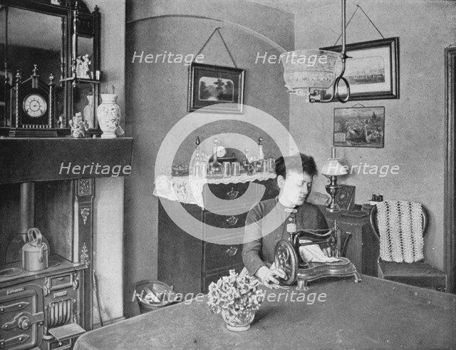 New room in a model dwelling, London, c1900 (1901). Artist: Unknown.