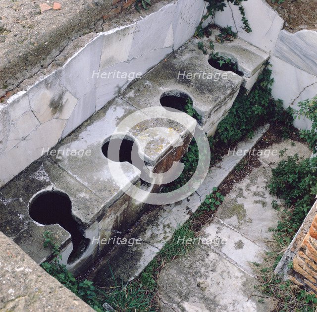 Roman toilet, Ostia, Italy. Artist: Unknown