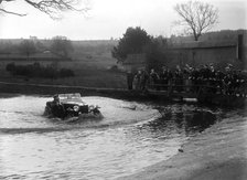 MG Magnette driving through a ford during a motoring trial, 1936. Artist: Bill Brunell.