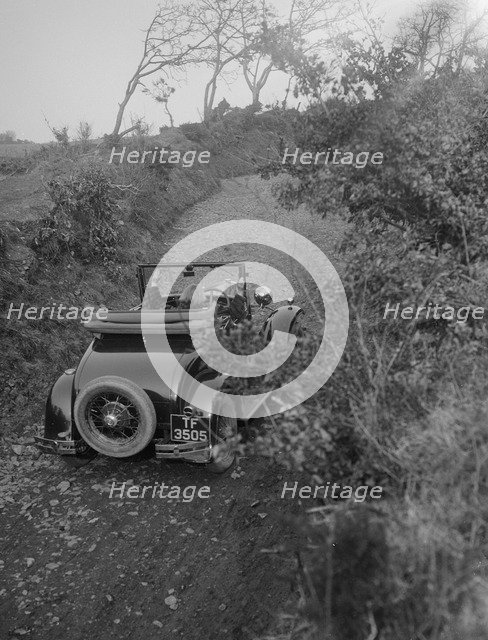 Kitty Brunell driving a 1930 2-seater Ford Model A, 1931.   Artist: Bill Brunell.