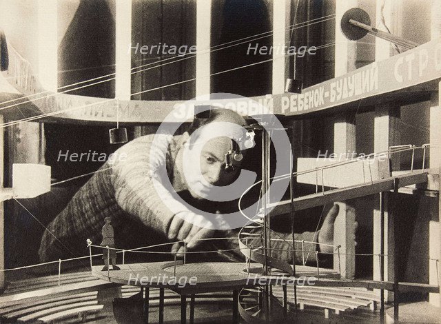 El Lissitzky Working on a Stage Design, Meyerhold Theatre, 1929. Creator: Anonymous.