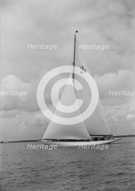 'Trivia', a 12 Metre class yacht sails close-hauled, 1939. Creator: Kirk & Sons of Cowes.