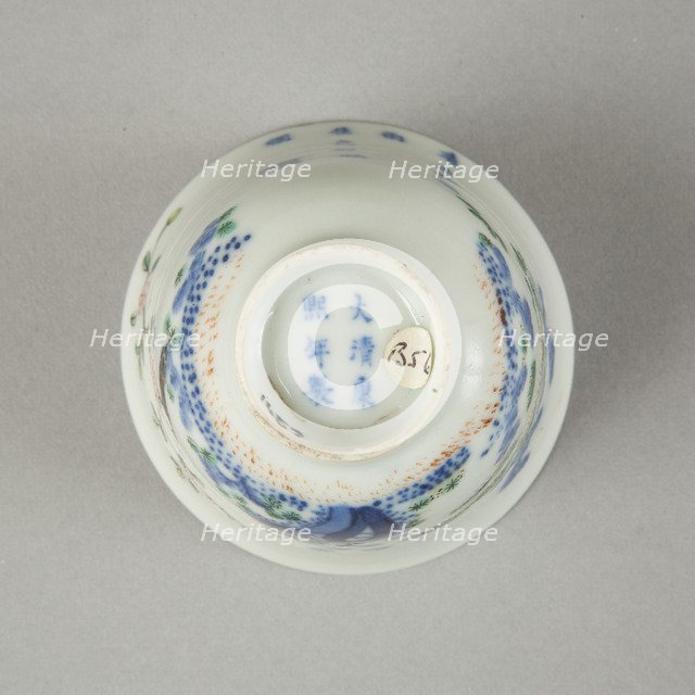 Underglaze blue month cup with polychrome enamelled decoration of a prunus tree. Artist: Unknown.