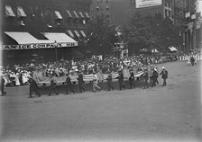 Preparedness Parade - Men Carrying Huge Flag, 1916. Creator: Harris & Ewing.