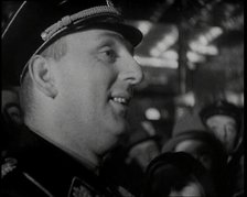 Man in Uniform Surrounded by a Crowd, 1930s. Creator: British Pathe Ltd.