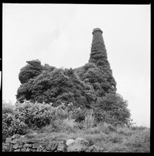 Ivy covered mine engine house and chimney, Cornwall, 1967. Creator: Eileen Deste.