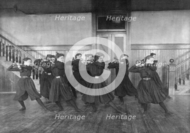 Female students exercising with dumbbells, Western High School, Washington, D.C., (1899?). Creator: Frances Benjamin Johnston.