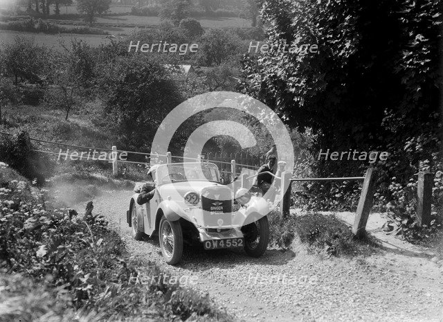1934 Singer Le Mans taking part in a West Hants Light Car Club Trial, Ibberton Hill, Dorset, 1930s. Artist: Bill Brunell.
