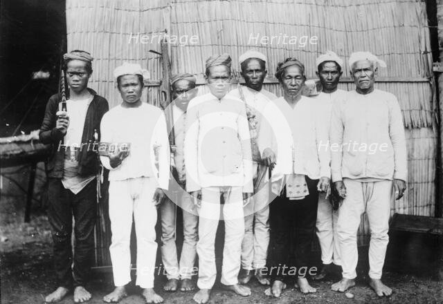 Philippines - Moro Datu And His Followers, 1913. Creator: Harris & Ewing.