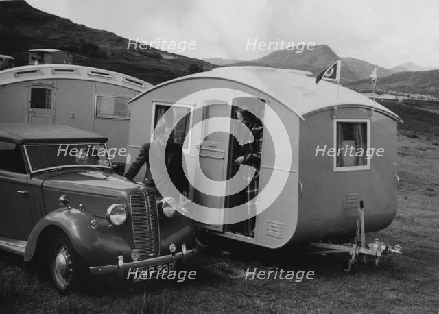 1939 Ausin Big Seven tourer with caravans. Creator: Unknown.