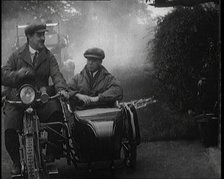 A Motorcycle and Sidecar Pulling up at a Petrol Station for a Refuelling, 1920. Creator: British Pathe Ltd.