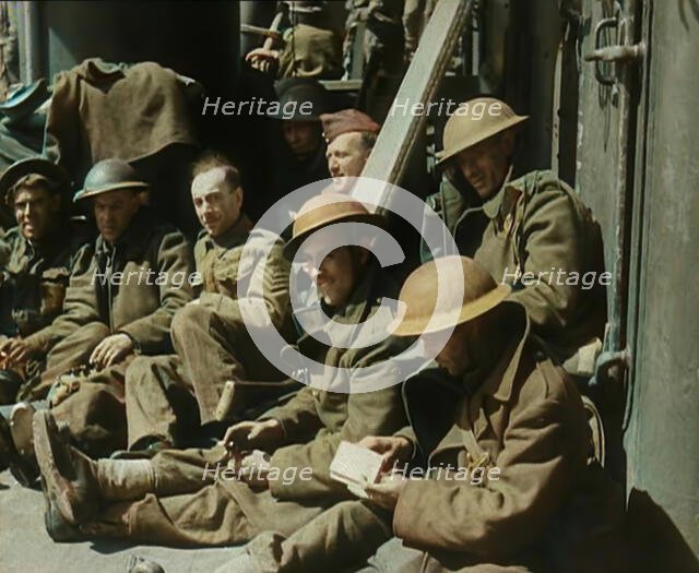 British Soldiers Sitting Aboard a Ship Taking Them Across the Channel Following the..., 1940. Creator: British Pathe Ltd.
