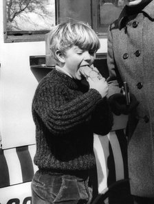 The Earl of St Andrews, aged 7, enjoying a hamburger, Gloucestershire, 1970. Artist: Unknown