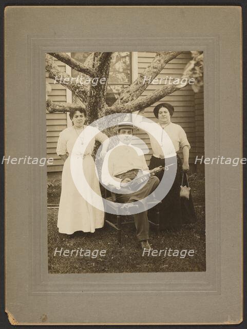 Portrait of a man and two women, about 1890-1900. Creator: Unknown.