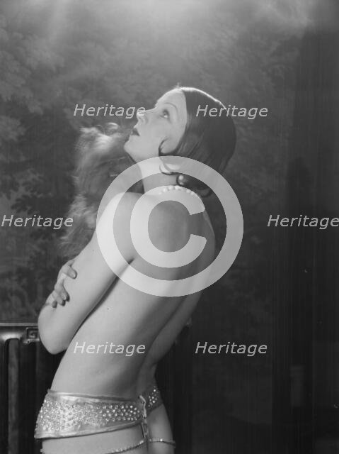 Carise, Erna, Mme., with dog, portrait photograph, 1928 Creator: Arnold Genthe.