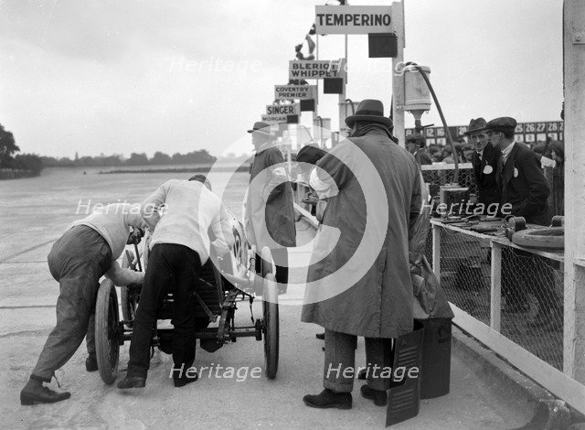 Temperino of JS Wood in the pits at the JCC 200 Mile Race, Brooklands, Surrey, 1921. Artist: Bill Brunell.