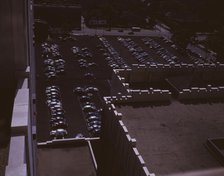 Looking down on a parking lot from the rear of the Fisher Building, Detroit, Mich., 1942. Creator: Arthur S Siegel.