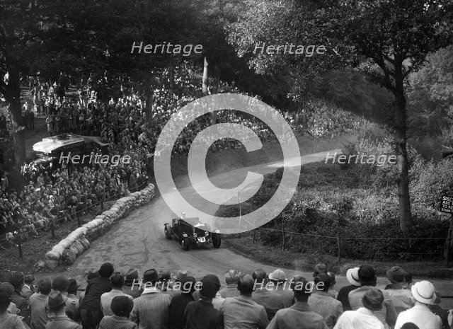 Railton light sports tourer competing in the Shelsley Walsh Hillclimb, Worcestershire, 1935. Artist: Bill Brunell.