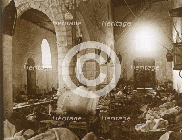 Makeshift hospital in a church, Marne, northern France, 1914. Artist: Unknown.