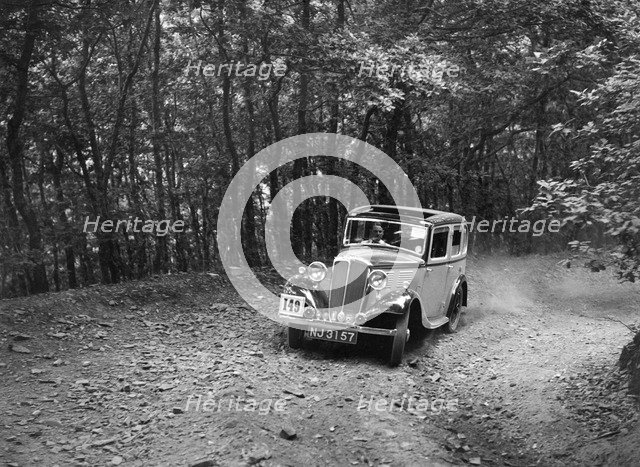 Standard competing in the B&HMC Brighton-Beer Trial, Fingle Bridge Hill, Devon, 1934. Artist: Bill Brunell.